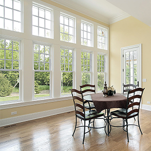 Dining room with tall windows lining wall