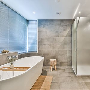 newly remodeled bathroom with tile and marble